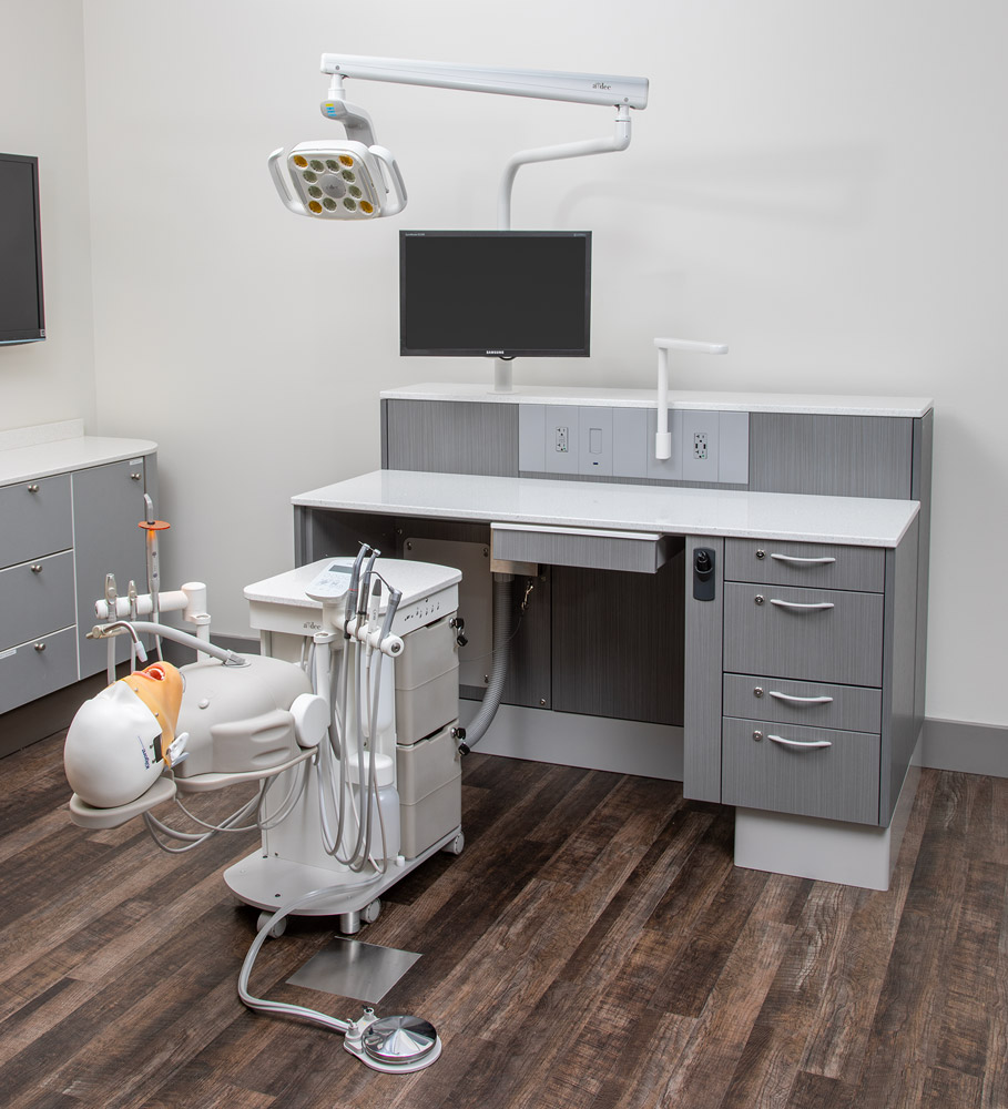 A-dec Simulator Pro units beneath Lab Workstation desks